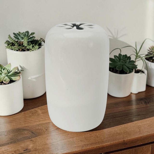 David Gil Spark Asterisk Vase produced by Bennington Potters and dated 1995. Executed in white glazed stoneware, the vase...