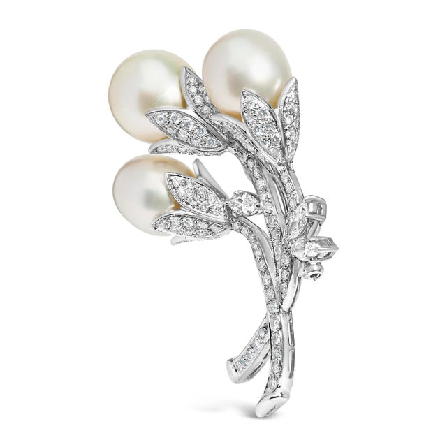 Discover the epitome of luxurious sophistication with this exquisite brooch, masterfully crafted from rhodium-plated 18K...