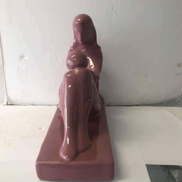 1980s mauve colored ceramic sculpture of a mother and child. Has Haeger label