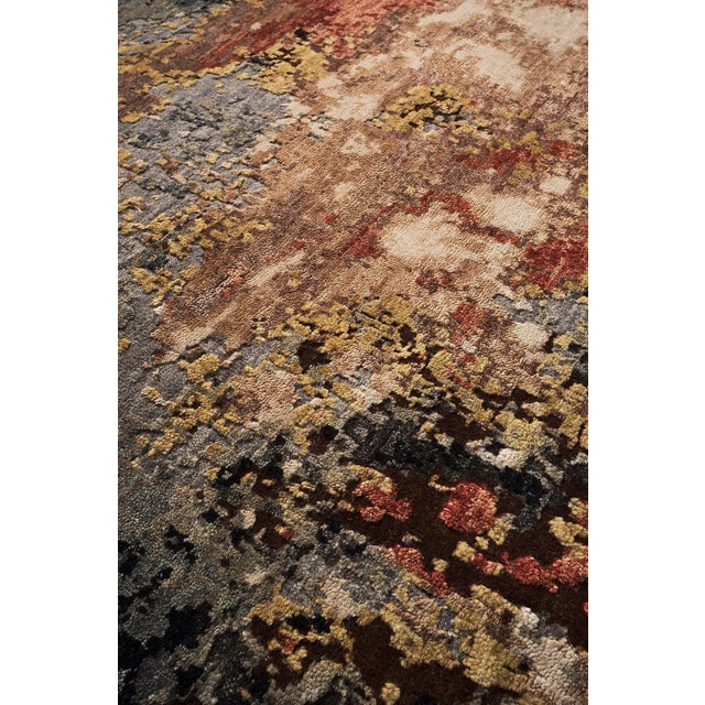 This beautiful rug and furnishing accessory combines a wool background with silk in a striking explosion of strong...
