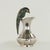 Mid century pitcher handcrafted in silver plate on hammered copper in modern form featuring a parrot as a handle clad in a...