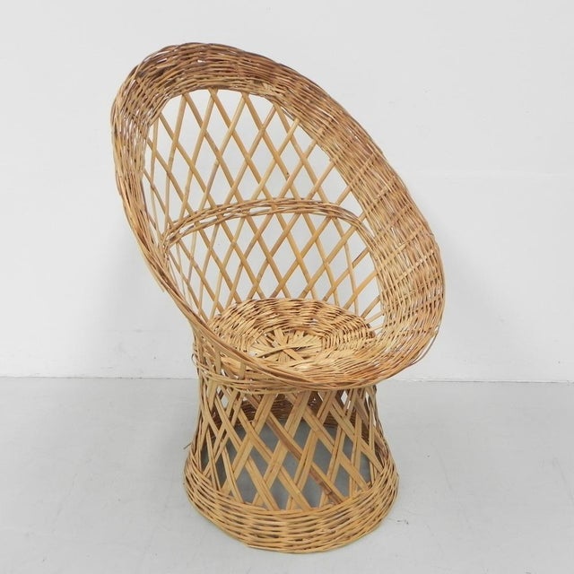 Height: 95 cm. Width: 65 cm. Depth: 60 cm. Origin: Belgium, 1970s. Material: rattan.