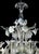 Venetian floreal Murano glass chandelier with leaves and flowers pinched by hand full of precious white details. That give...