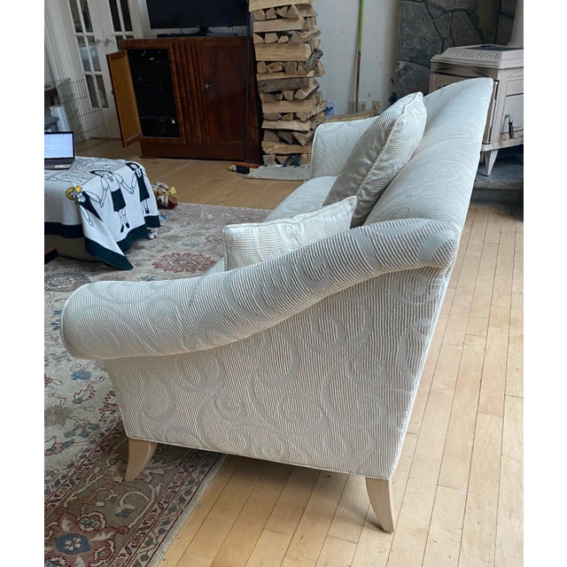 Contemporary white fabric sofa with swirl detail fabric. Blond wood curved legs and modern design. 3 Matching fabric...