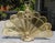 This is a beautiful fireplace screen that can close up and store when not in use. It is an expandable peacock feather fan...