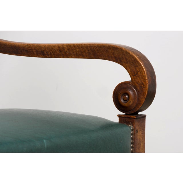 An elegant early 19th-century French Empire style walnut sofa, sourced in Lyon, France. Featuring a beautifully...