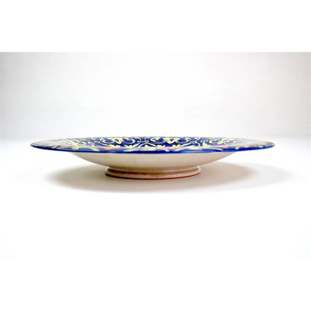 A beautiful hand-painted Italian ceramic decorative dish, vide-poche, or centerpiece with flower motifs in yellow blue,...