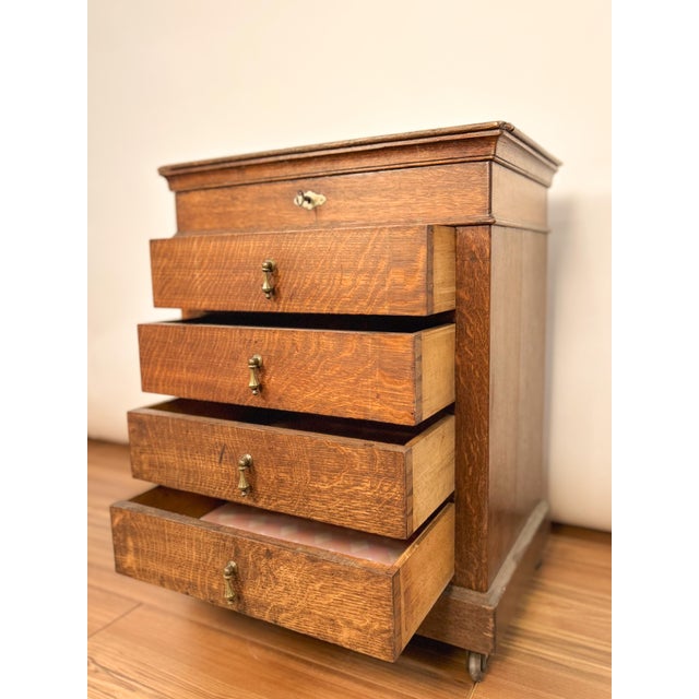1920s French sewing unit crafted from solid oak with its original finish. Its compact form and rich patina bring warmth...