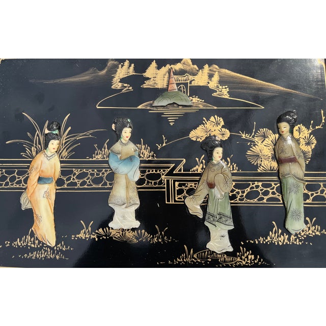 Steal the spotlight with this elaborately carved set of four (4) Chinoiserie tables. Black lacquered wood with hand...