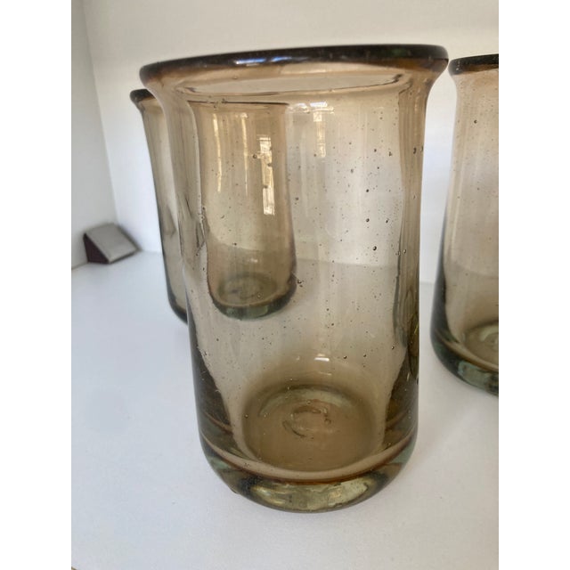 A charming set of 5 hand blown amber heavy glass hurricanes Photos don’t do these justice. The amber color is very...