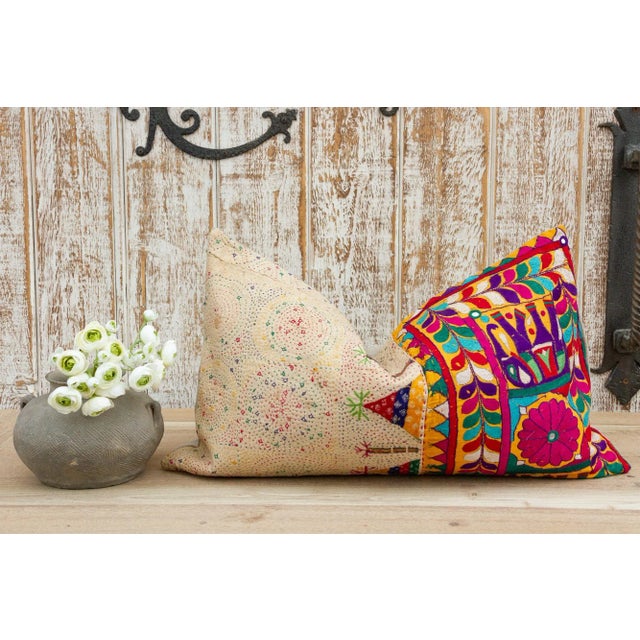 These colorful throw pillows are made from Rabari tribal dowry bags. The embroidery is on cotton and has intricate chain...