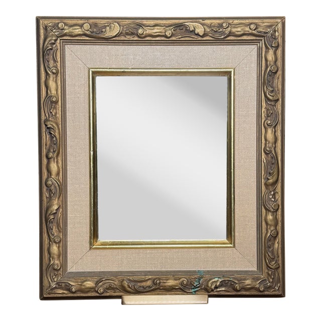 A French Provincial style solid wood bronze painted finish adorns this accent wall mirror. The mirror is surrounded with a...