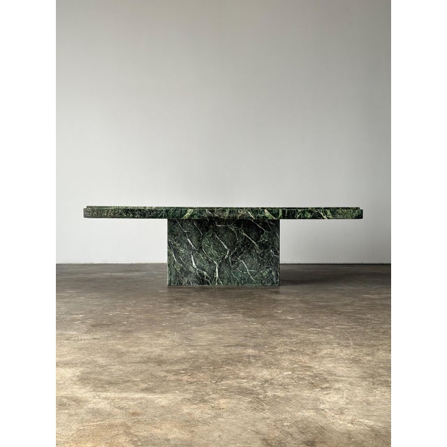 This vintage coffee table is pure drama — cut from Verde Alpi, a marble quarried in Italy's Aosta Valley— prized for its...