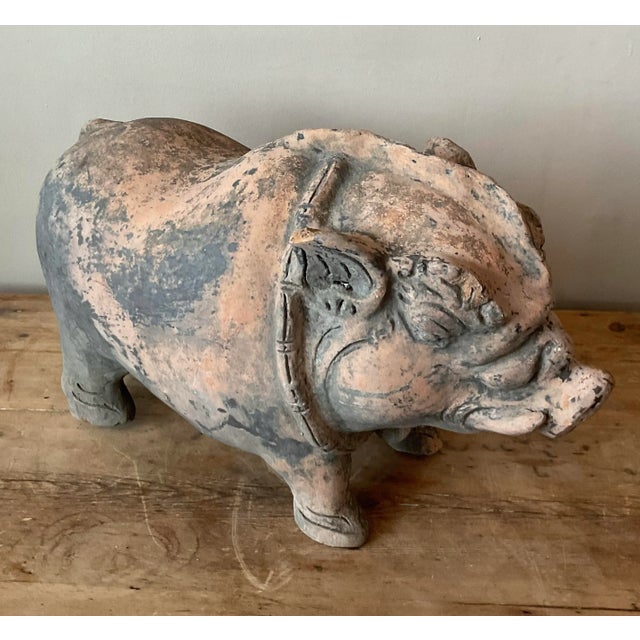 This charming vintage terracotta pig sculpture embodies a whimsical folk art aesthetic, perfect for adding character to...