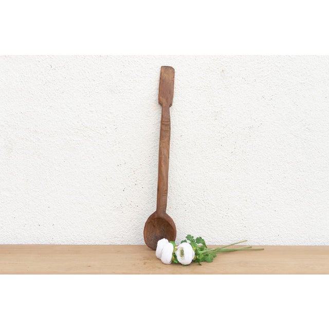 There is something deeply soulful about a simple wooden spoon—especially one carved by hand to feed a village. This...