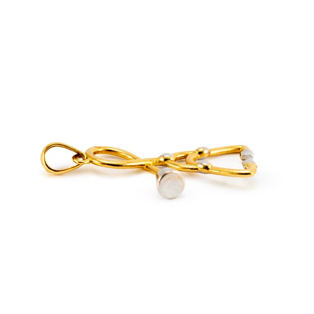 Gender: Unisex Metal Type: 18K Yellow & White Gold Length: 1.25 inches Width: 11.60 mm Weight: 1.80 grams Unisex 18K white...