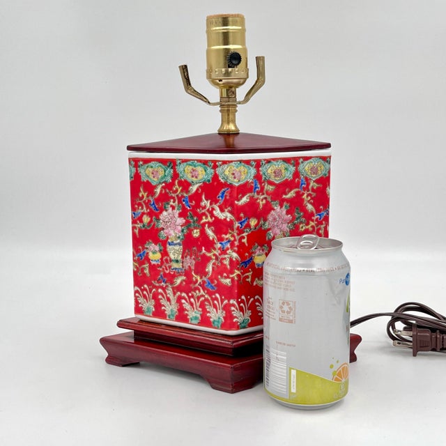 Mid-Century Chinoiserie floral ceramic table lamp. Designed in a distinctive diamond shape, this vintage piece features a...