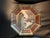 This octagonal glass plate features detailed decoupage designs, hand-finished in the signature style of artist Durwin...