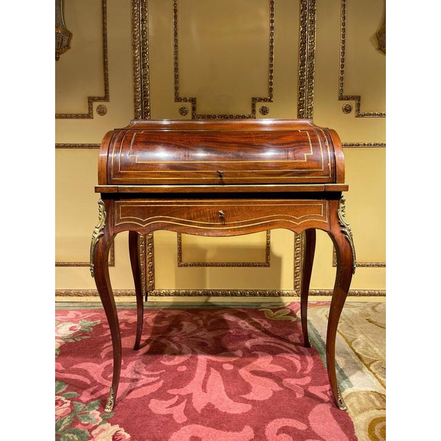 Unique French roll-up secretary/desk in the transition style from around 1890s. Mahogany and brass inlays. Writing surface...