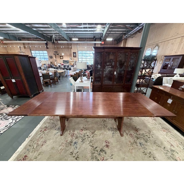 A monumental Stickley Mission Collection trestle dining table crafted in the spirit of classic American Arts & Crafts...