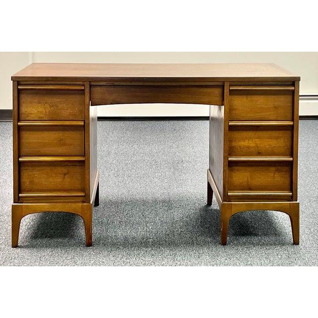 Classic mid century modern desk by Lane. The “Rhythm” desk is crafted in walnut. Features a double pedestal design with 3...