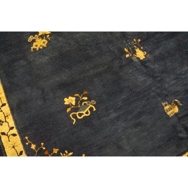 Antique Peking Chinese Floral Blue Navy 1900s Rug, Circa Date: 1900s. This exceptional example of early 20th-century...