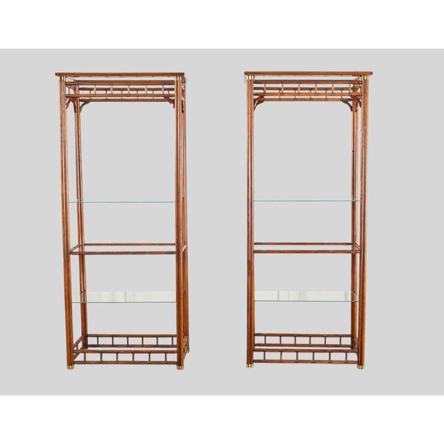 Elevate your space with this striking pair of mid-century modern faux bamboo etageres by Heritage. Crafted from solid oak...