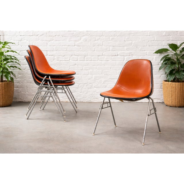 Set of 4 - Authentic vintage Herman Miller Eames Padded Shell Chairs, c. 1950’s. This set features classic orange/red...