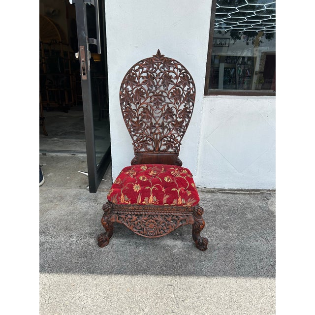 Stand out 19th century Anglo Indian chair with an unusual form, handcrafted in mahogany with floral carvings throughout...