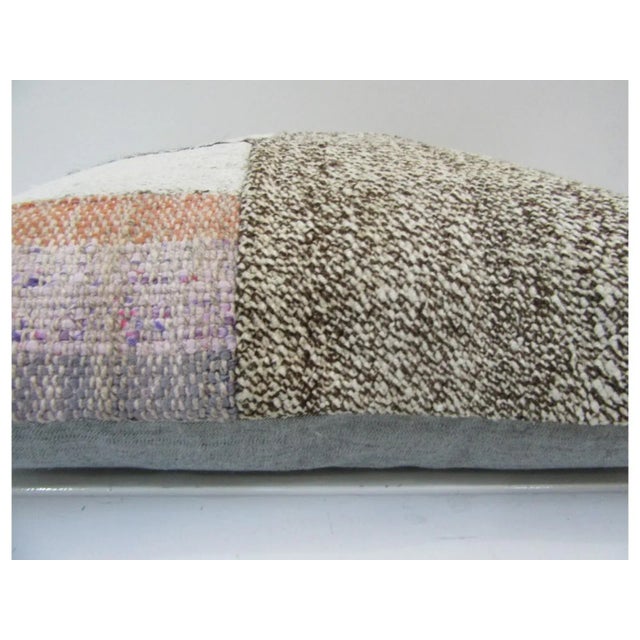 This is a pillow cover made from a vintage kilim rug. The piece was properly washed and ready to use. Pillow inserts not...