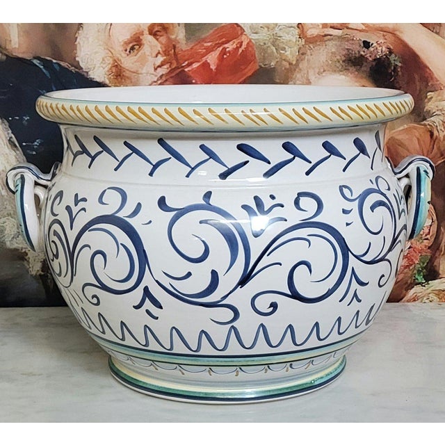 Saca Castelli, Italy, early 20th century: Large glazed earthenware cachepot or planter, richly hand-decorated with a...