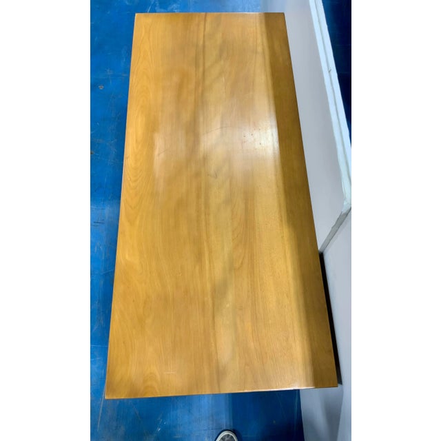 Timeless satin and ebony finished Vintage Mid-Century Modern Chest of Drawers, three drawers, circular brass pulls, circa...