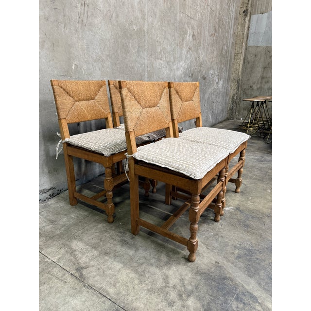 Handsome set of vintage rush seat and back dining chairs in solid oak — the classic French/Continental country form, and...