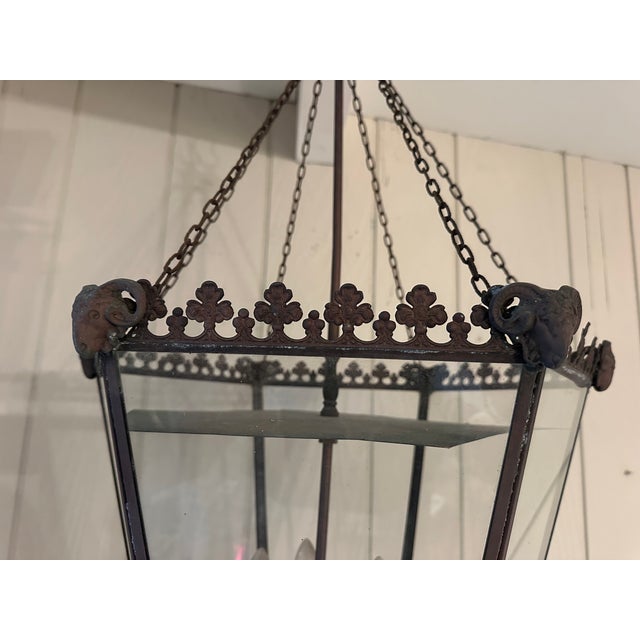 Stunning vintage metal tole lantern having pierced gallery at the top and decorative ram’s heads. 6 glass panels 4 lights...
