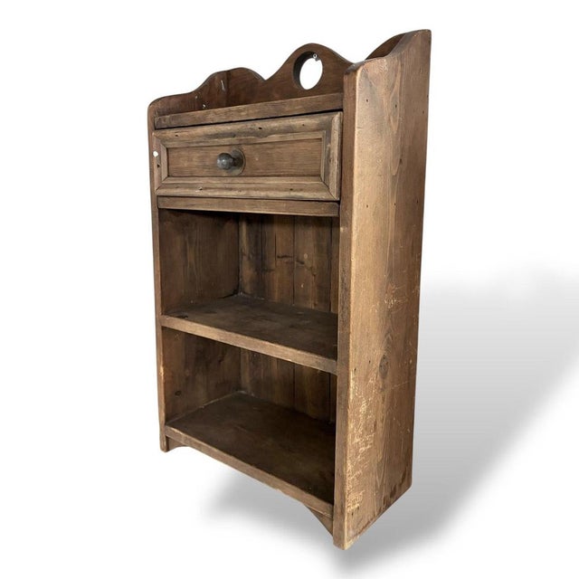A charming vintage oak and pine bathroom cabinet, offering practical storage in a compact and characterful form. The...