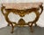 Marble-top Louis XV style console table by Jansen. This is a fine and early example of French design at its best. This...