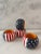 Set of 4 hand painted Stars and Stripes wood napkin rings with orange interior by Lenox. Two sets available.