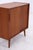 Vintage teak chest of drawers with clean lines and practical sliding doors. The slender, tapered legs and beautiful grain...