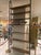 Terra Cielo bookcase or room divider. Scandinavian-style ceiling-mounted shelving unit, 1960s. Lacquered metal uprights...