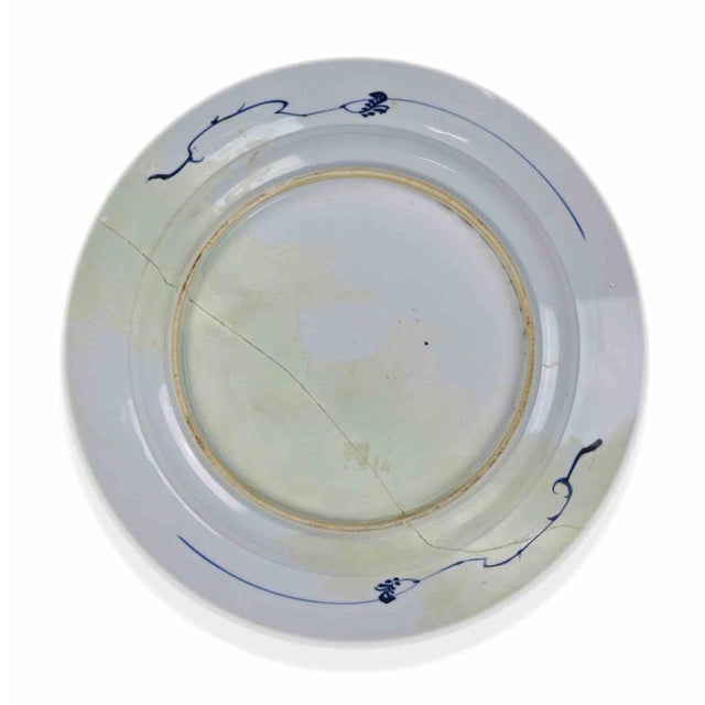 Imari porcelain plate realized in Japan in 19th Century (Edo Period). Hand-painted overglaze enamel on porcelain. The...