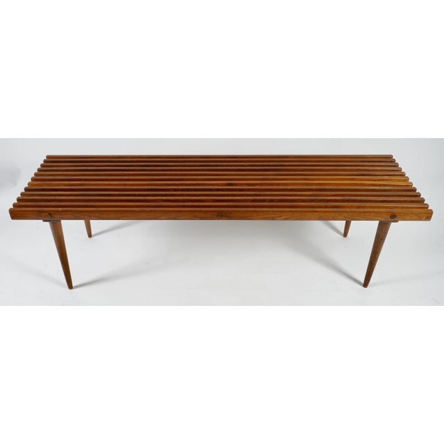 This is a mid-century modern slatted bench, similar in style to the George Nelson Slat Bench. Handmade walnut bench with...