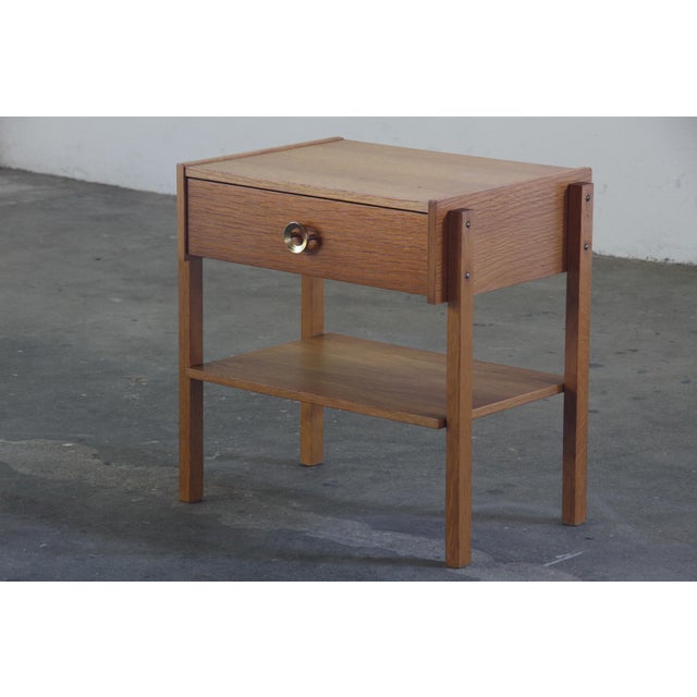 This oak bedside table is a simple and functional piece inspired by Scandinavian design from the 1970s. It has a clean...