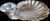 Vintage W.M. Rogers silver-plated clamshell shape serving dish featuring a built-in dip cup, finished in a scalloped shape...