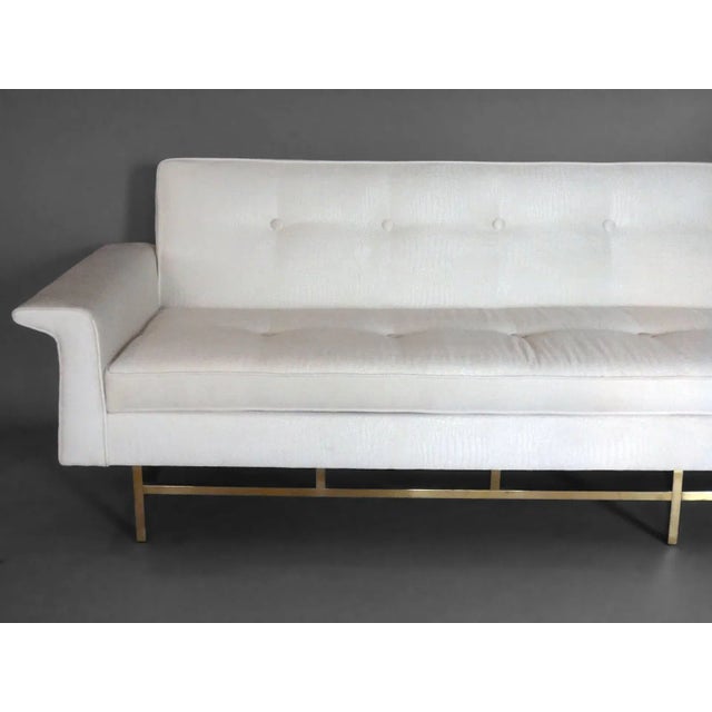 Large brass based Edward Wormley style couch. Completely rebuilt from the inside out .
