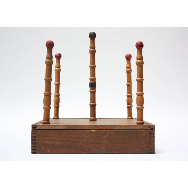 Early 20th Century Ring Toss composed of a game board, which doubles as a storage box for the accessories when not in...