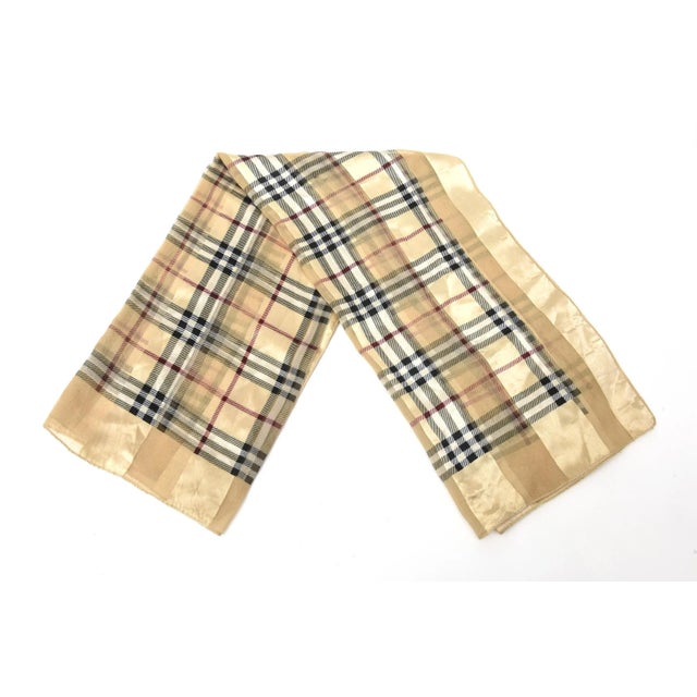 This stunning and very vintage Burberry silk satin scarf is most likely from the 60's. It is a great size and has not been...
