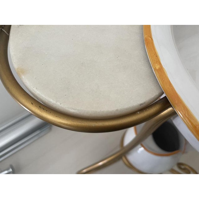 Italian marble washing table vintage design 1980s Gold colored metal frame with candleholders and a marble top Ceramic...