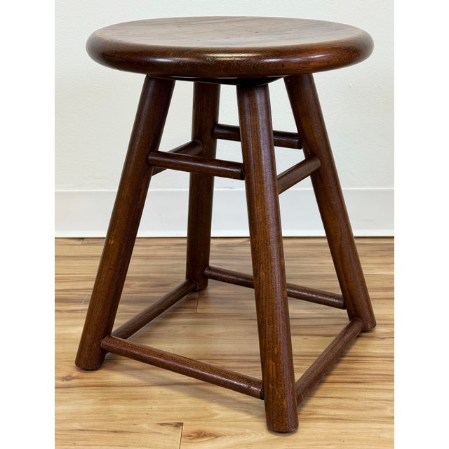 Vintage round dark stained swivel stool or plant stand. Marked as manufactured by a Chicago USA maker. Legs measure beyond...