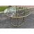An iconic patio dining set in brass designed by Walter Lamb and produced by Brown Jordan (Set of 5). The round table frame...