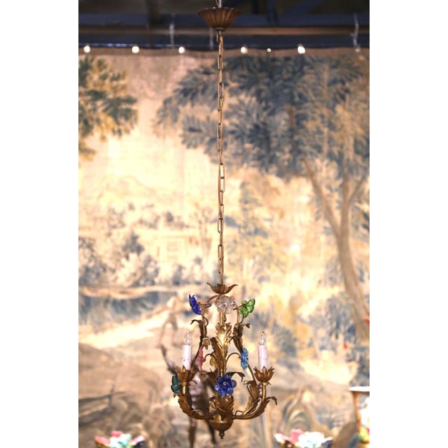 This delicate antique floral chandelier combines the warmth of gilt metal with colorful hand-fashioned glass blossoms,...